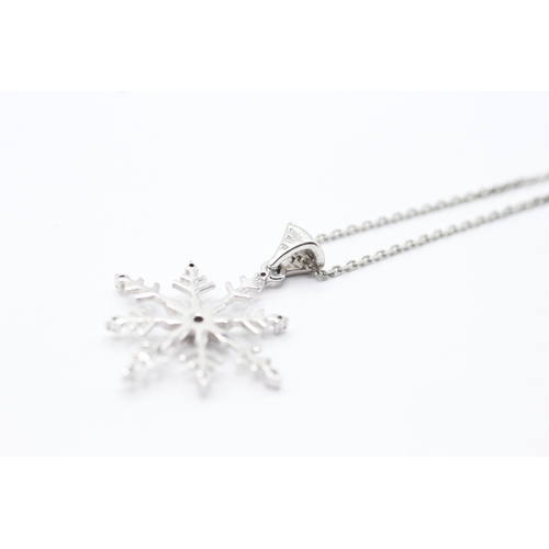 153 - 9ct gold diamond snowflake pendant on chain (3.8g)