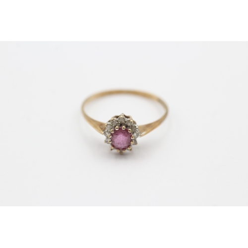 156 - 9ct gold pink gemstone and diamond halo set ring (1.3g) Size O