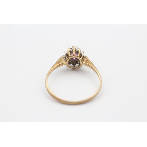 156 - 9ct gold pink gemstone and diamond halo set ring (1.3g) Size O