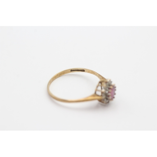 156 - 9ct gold pink gemstone and diamond halo set ring (1.3g) Size O