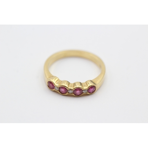 162 - 18ct gold ruby and diamond row set ring (3.8g) Size M