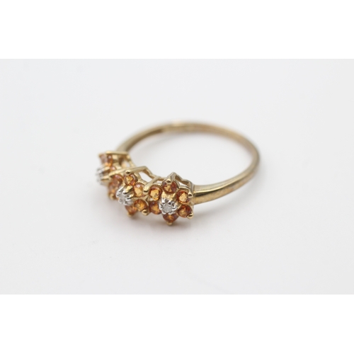 169 - 9ct gold orange gemstone and diamond flower set ring (2.3g) Size Q