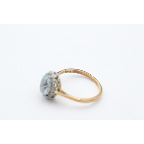 172 - 18ct gold diamond and blue gemstone ring (2.4g) Size K