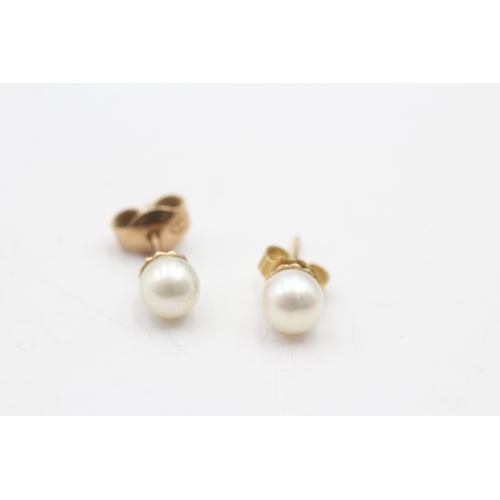 174 - 14ct gold cultured pearl stud earrings (2.3g)