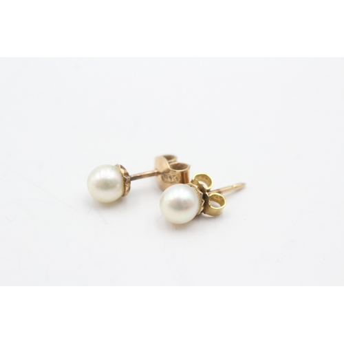 174 - 14ct gold cultured pearl stud earrings (2.3g)