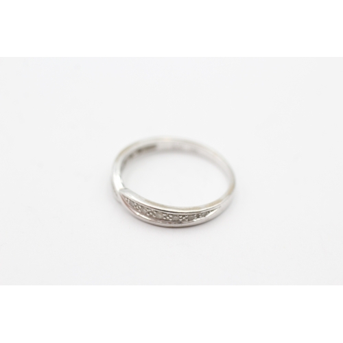 187 - 18ct gold diamond twist ring (2g) Size J