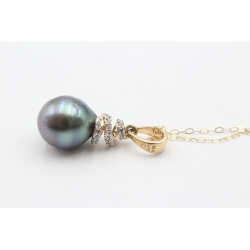 193 - 9ct gold cultured pearl and diamond pendant on chain (3.7g)