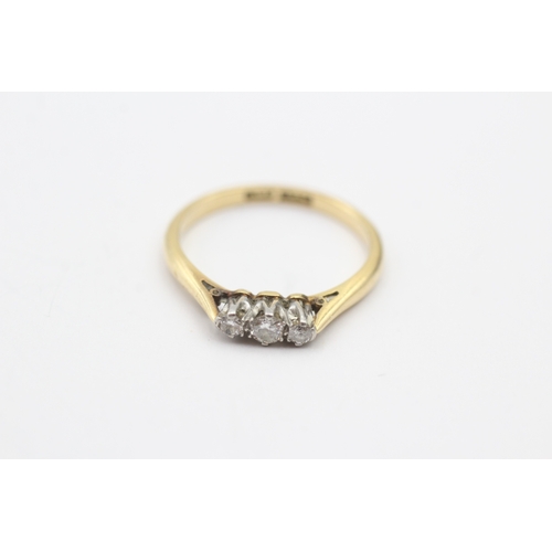 201 - 18ct gold three stone diamond ring (2.3g) Size M