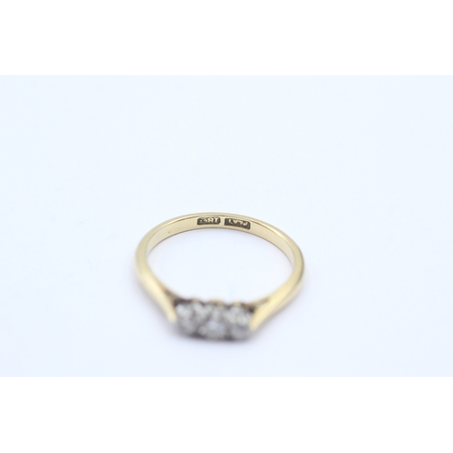 201 - 18ct gold three stone diamond ring (2.3g) Size M