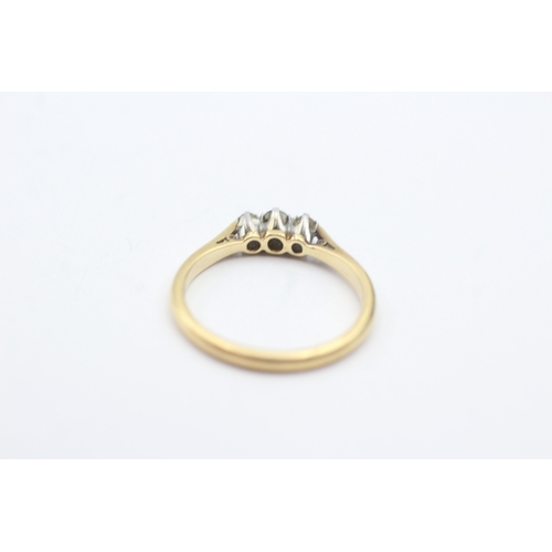 201 - 18ct gold three stone diamond ring (2.3g) Size M