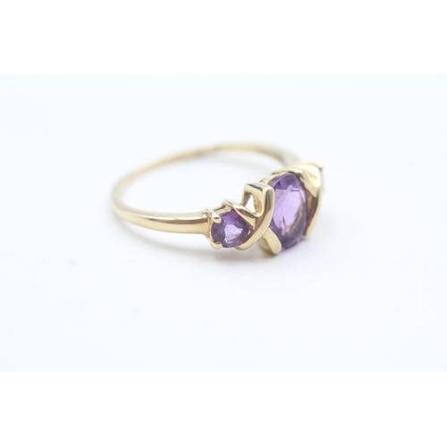 204 - 9ct gold oval and round cut purple gemstone ring (2.1g) Size Q