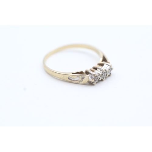 205 - 9ct gold three stone diamond ring (1.7g) Size O