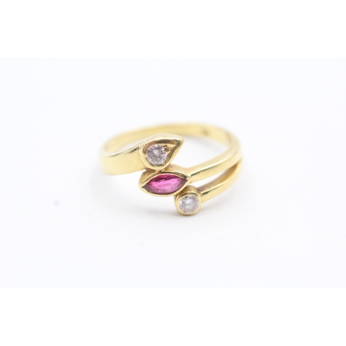 21 - 18ct gold diamond and ruby set bypass ring (3.9g) Size O 1/2