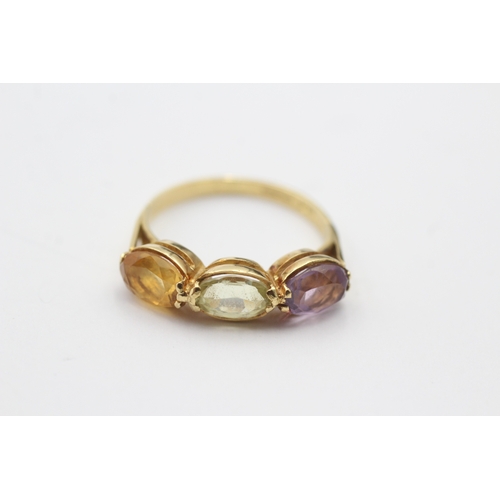 212 - 18ct gold amethyst, citrine and chrysoberyl set trilogy ring (2.9g) Size L