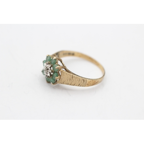 231 - 9ct gold diamond and emerald ring (1.8g) Size N