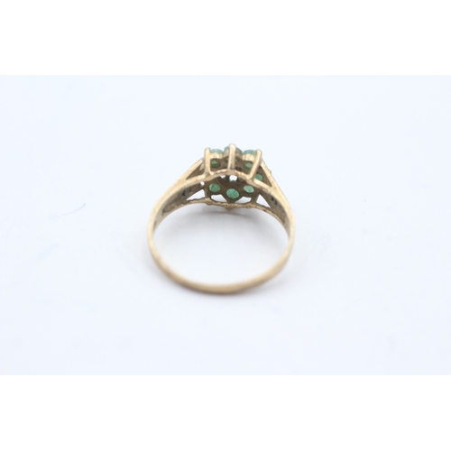 231 - 9ct gold diamond and emerald ring (1.8g) Size N