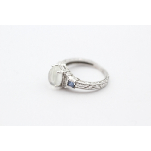 239 - 14ct gold moonstone, diamond and sapphire ring (3g) Size J 1/2