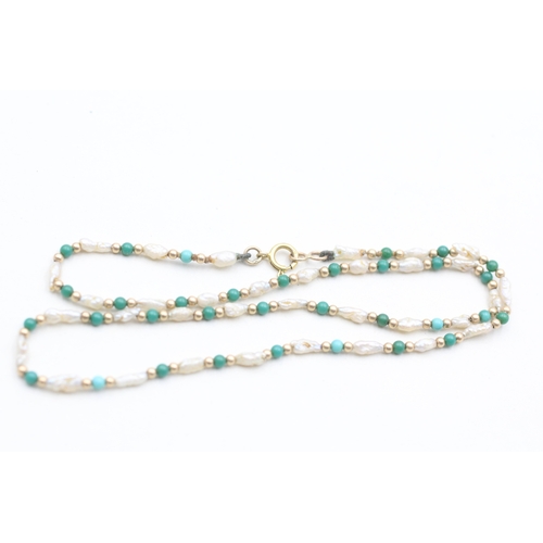 243 - 9ct gold rice pearl and blue gemstone beaded necklace (3.2g)