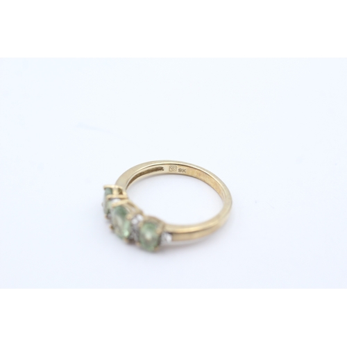 34 - 9ct gold green gemstone and diamond flat setting ring (2g) Size J 1/2