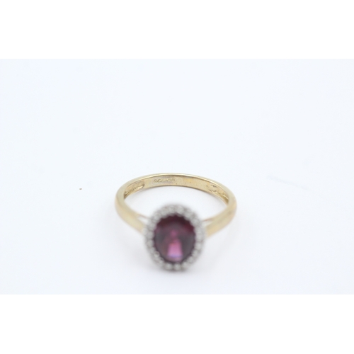 35 - 9ct gold red gemstone and diamond halo ring (1.8g) Size J 1/2