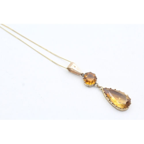 39 - 9ct gold orange gemstone drop pendant on chain (2.6g)