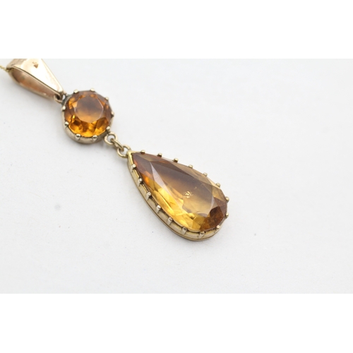 39 - 9ct gold orange gemstone drop pendant on chain (2.6g)