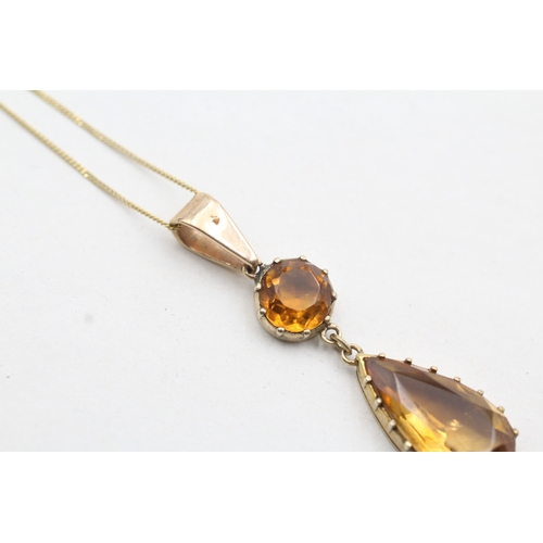 39 - 9ct gold orange gemstone drop pendant on chain (2.6g)