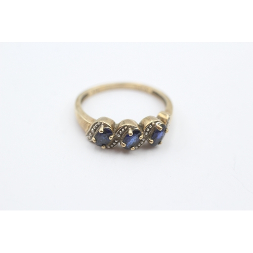 48 - 9ct gold sapphire and diamond three stone ring (2g) Size N