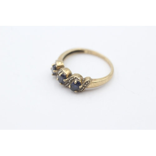 48 - 9ct gold sapphire and diamond three stone ring (2g) Size N