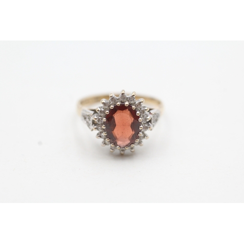 50 - 9ct gold red and white gemstone halo set ring (3g) Size M