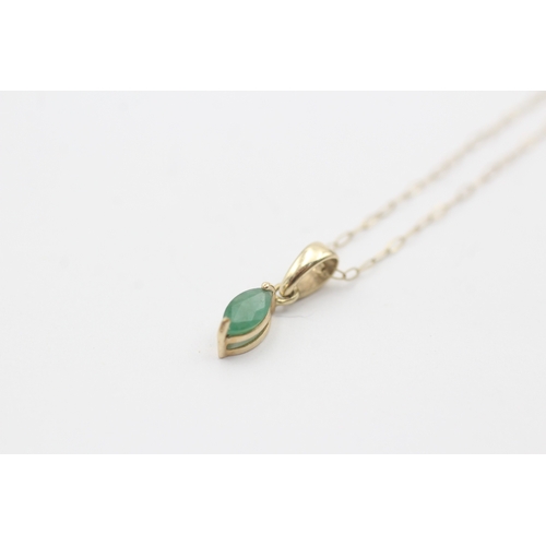 53 - 9ct gold green gemstone pendant on chain (0.6g)