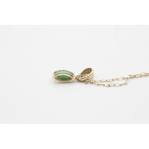 53 - 9ct gold green gemstone pendant on chain (0.6g)