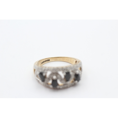 87 - 9ct gold sapphire and diamond open work ring (4g)