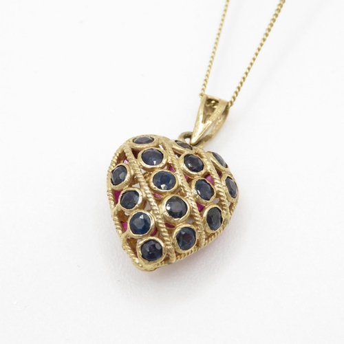 63 - 9ct gold ruby and sapphire heart pendant on chain (2.6g) Size