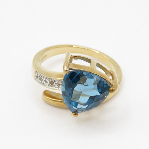 67 - 9ct gold blue topaz & diamond dress ring (5g) Size N