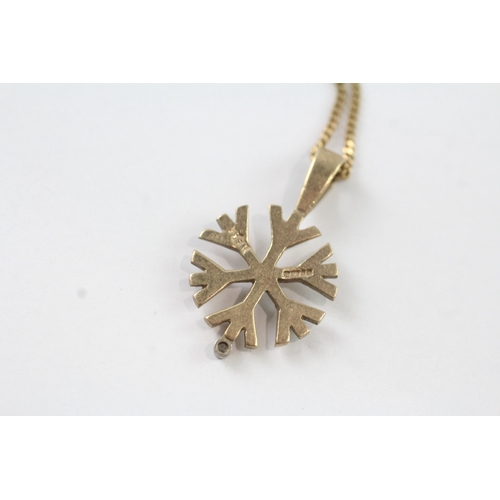 53 - 9ct gold snowflake and diamond pendant on chain (3.9g) Size