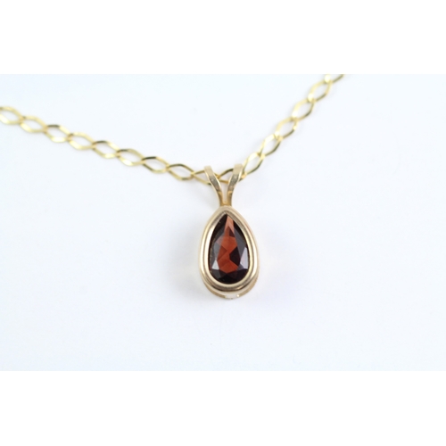 62 - 9ct gold red gemstone pear shape pendant on chain (1.4g) Size