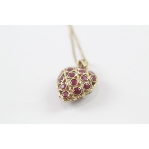 63 - 9ct gold ruby and sapphire heart pendant on chain (2.6g) Size