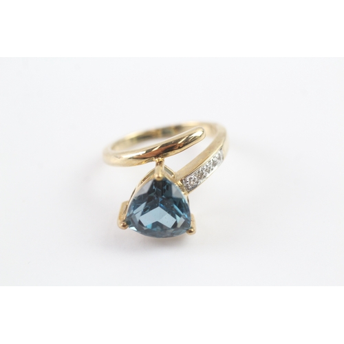 67 - 9ct gold blue topaz & diamond dress ring (5g) Size N