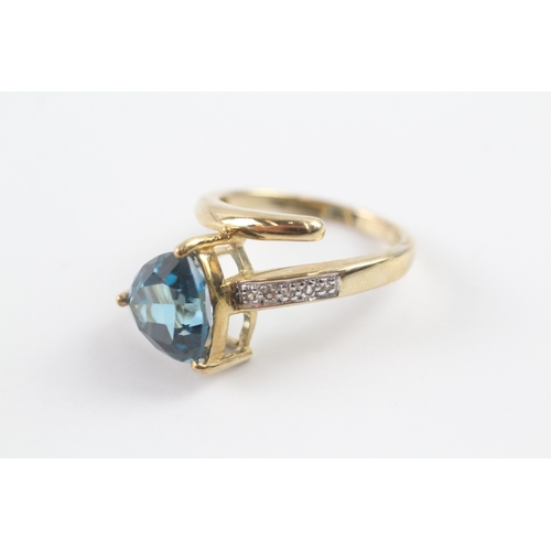 67 - 9ct gold blue topaz & diamond dress ring (5g) Size N