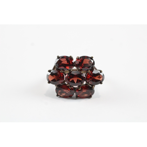 68 - 9ct gold garnet cluster cocktail ring (5.5g) Size N