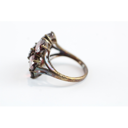 68 - 9ct gold garnet cluster cocktail ring (5.5g) Size N