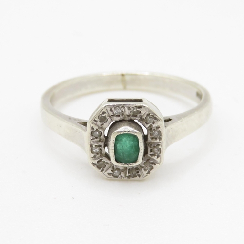 106 - 9ct gold diamond and green gemstone ring (2.7g) Size M