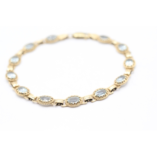 10 - 9ct gold blue gemstone bracelet (7.6g)