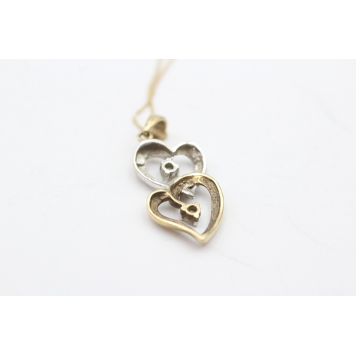 105 - 9ct gold diamond heart pendant on chain (2g)