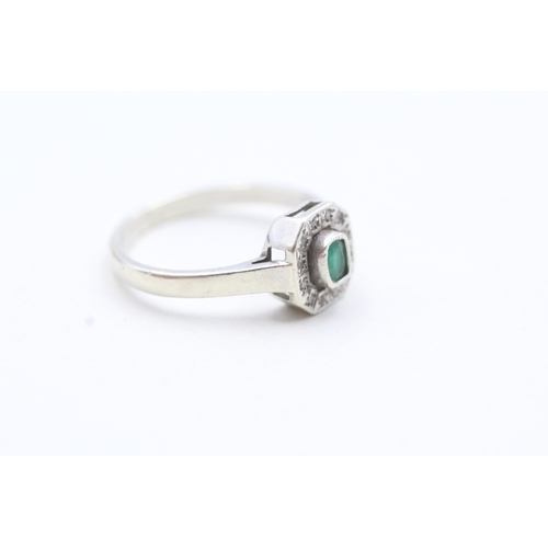 106 - 9ct gold diamond and green gemstone ring (2.7g) Size M