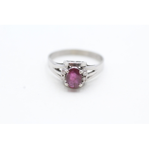 122 - 14ct white gold ruby and diamond framed ring (2.6g) Size N