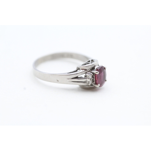 122 - 14ct white gold ruby and diamond framed ring (2.6g) Size N