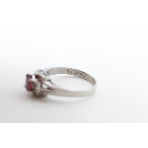 122 - 14ct white gold ruby and diamond framed ring (2.6g) Size N