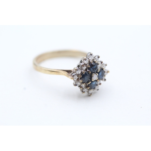 128 - 9ct gold cluster set diamond and blue gemstone ring (3.7g) Size S